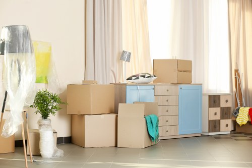Professional packers organizing items in Storage Brent