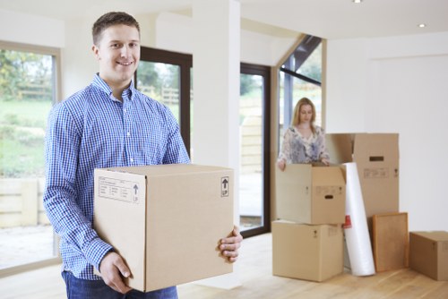 Professional removalist team packing household items for a move in Brent